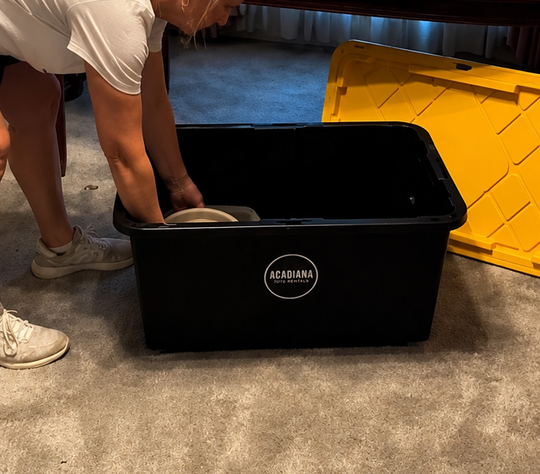 Packing belongings into a moving tote